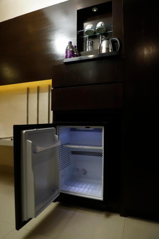 Kuchyň nebo kuchyňský kout v ubytování Udman Hotel Chhattarpur