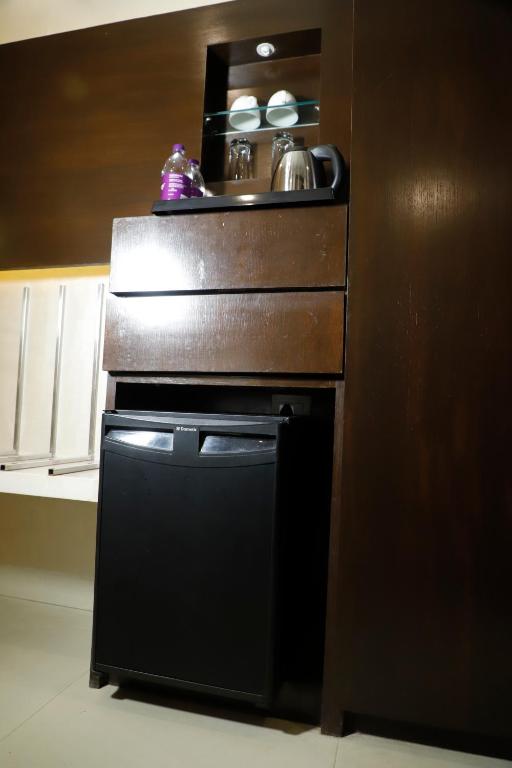 Kuchyň nebo kuchyňský kout v ubytování Udman Hotel Chhattarpur