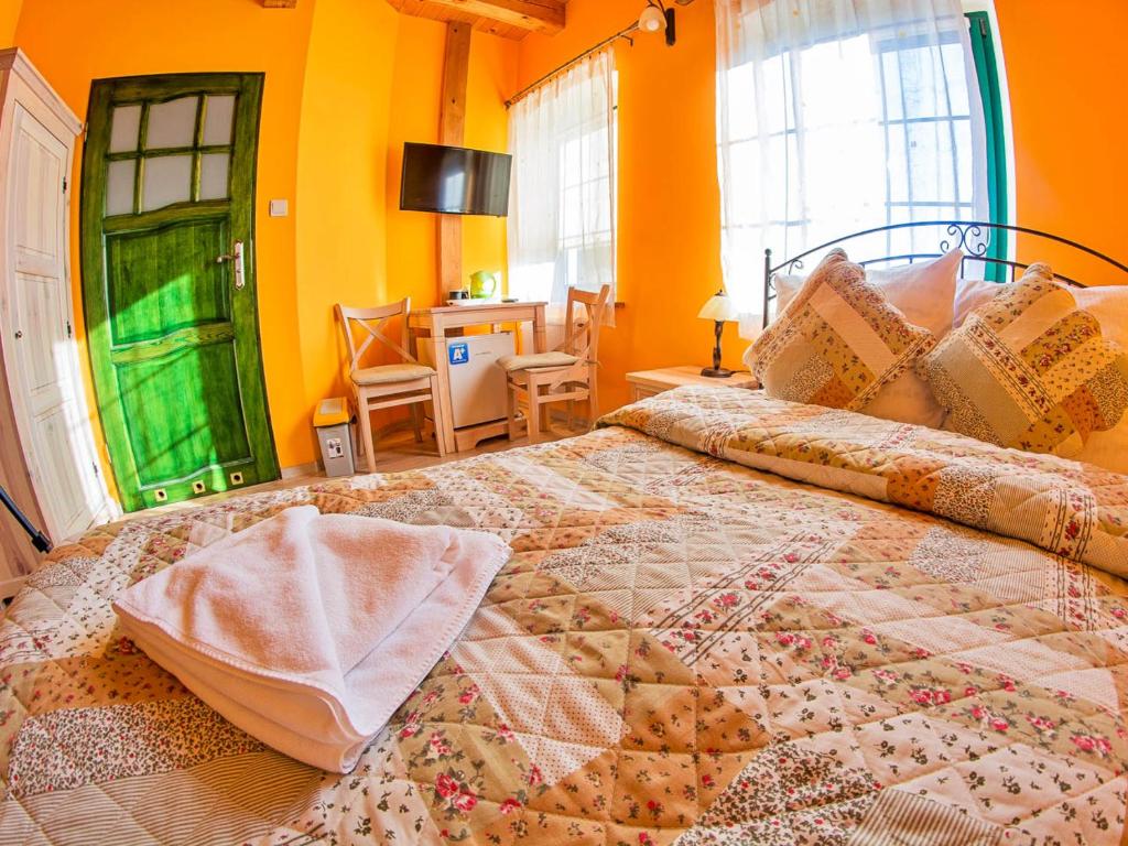 Postel nebo postele na pokoji v ubytování Młyn Wielisław Agroturystyka i Restauracja
