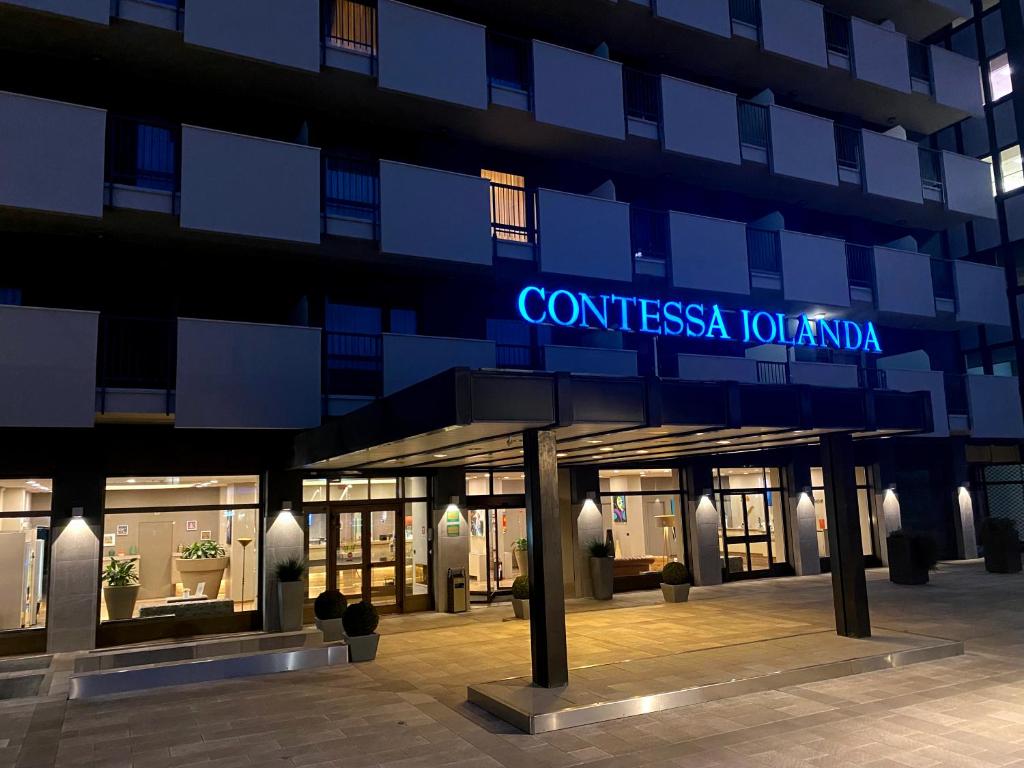 a building with a sign that reads condiscista jolanda at UNAWAY Hotel & Residence Contessa Jolanda Milano in Milan