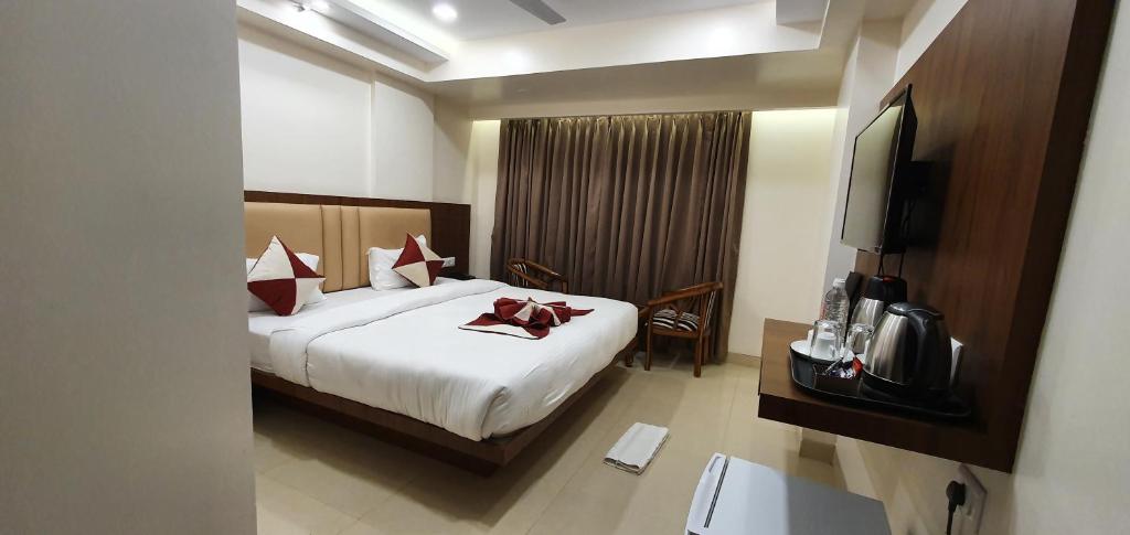 Postel nebo postele na pokoji v ubytování Hotel MK Grand
