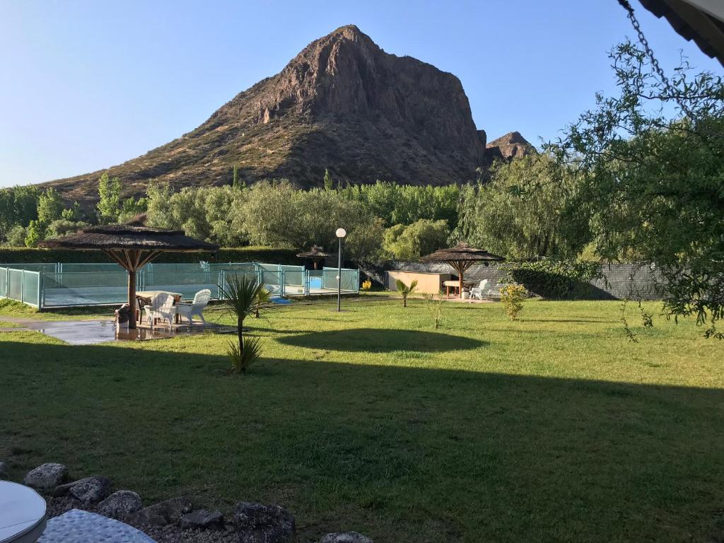 a resort with a mountain in the background at BRISAS DEL VALLE San Rafael in Valle Grande