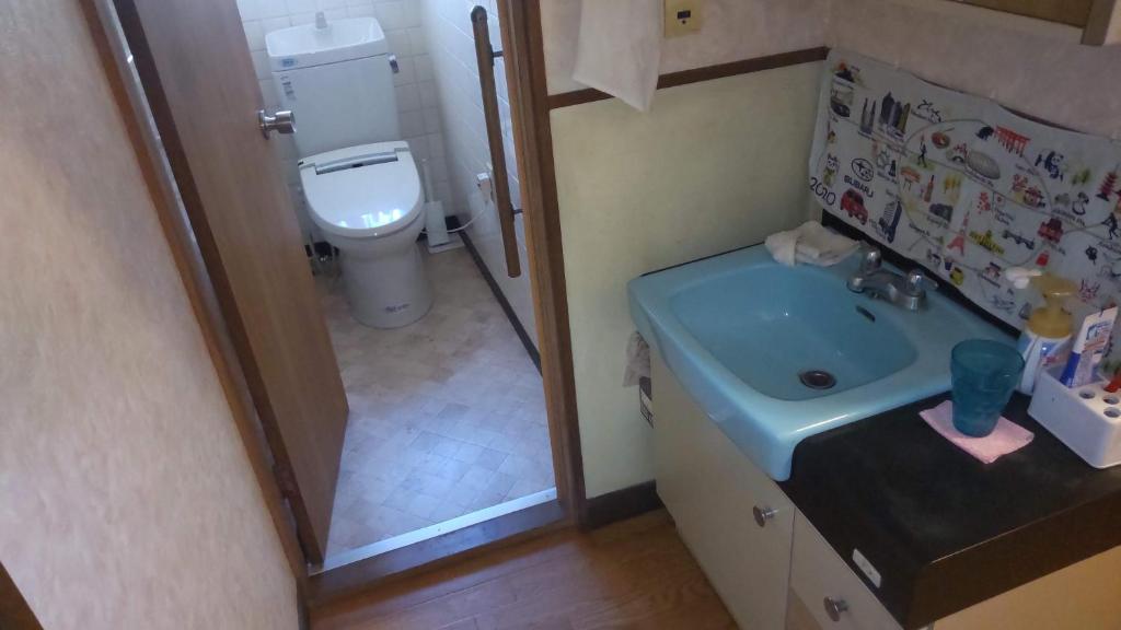 Koupelna v ubytování Guesthouse Oomiya base 大宮基地別荘