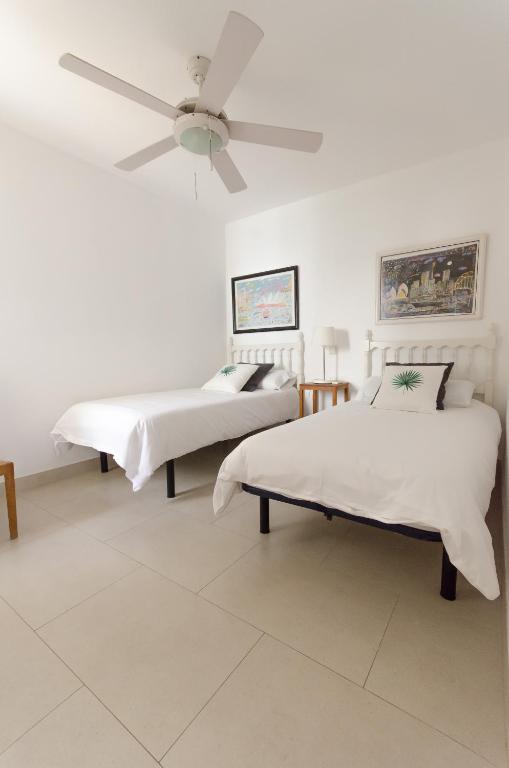 Postel nebo postele na pokoji v ubytování Vv - San Agustín Seaview Apartment