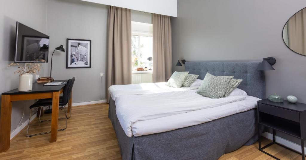 Postel nebo postele na pokoji v ubytování Stora Hotellet Markaryd