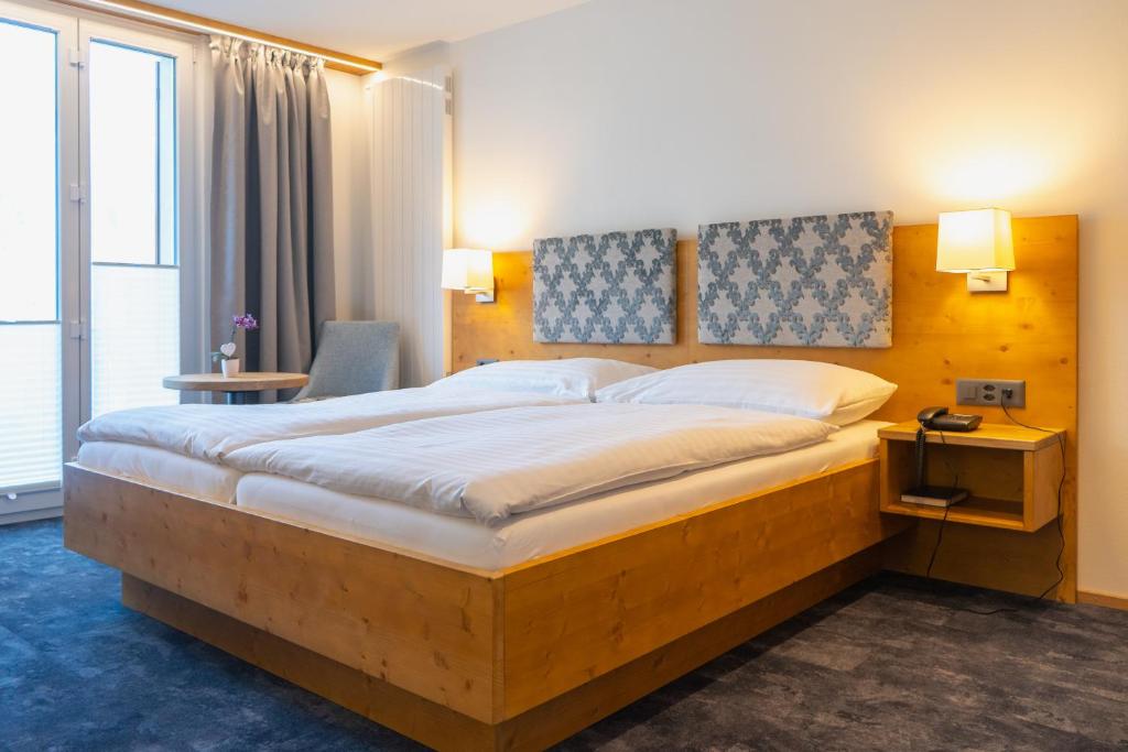 Postel nebo postele na pokoji v ubytování Hotel Strandhotel