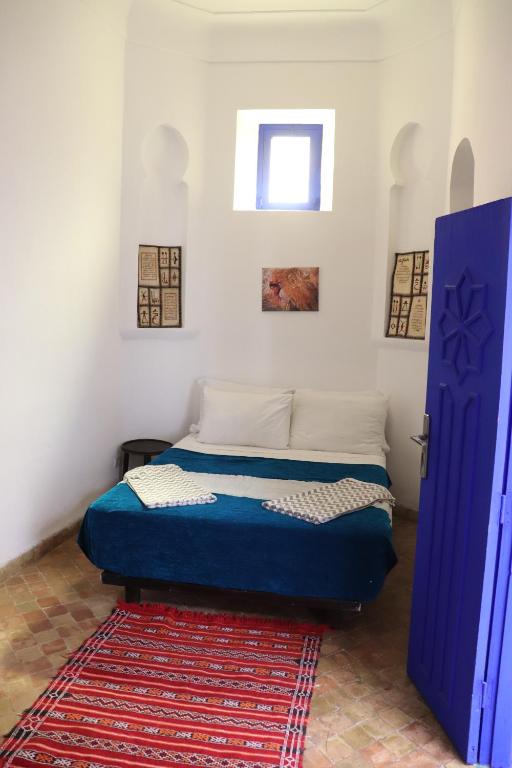 Postel nebo postele na pokoji v ubytování Hotel Dar El Qdima