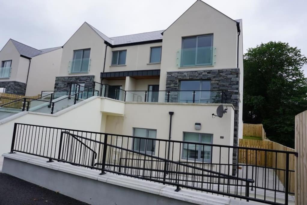 a house with balconies on the side of it at Bluestack View Apartment in Donegal