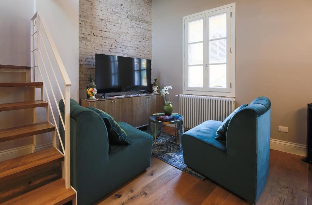 Televízia a/alebo spoločenská miestnosť v ubytovaní Apartments Florence - Angel's Loft