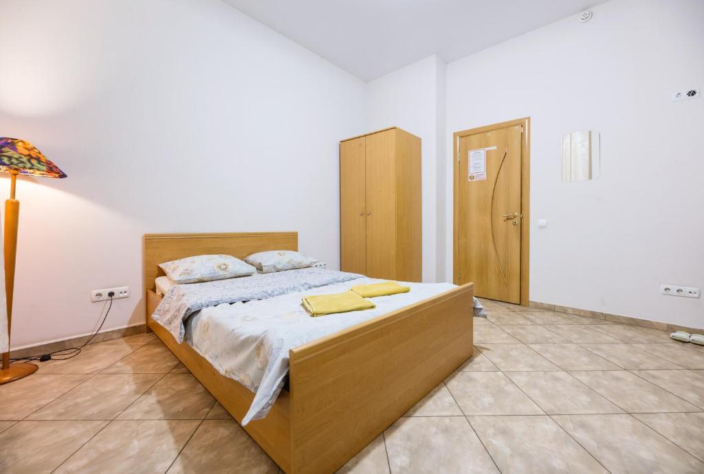 Postel nebo postele na pokoji v ubytování Mini Hotel near Arena City
