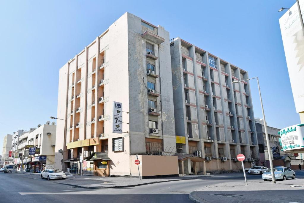 a tall building on the corner of a city street at OYO 119 Le Vondome in Manama