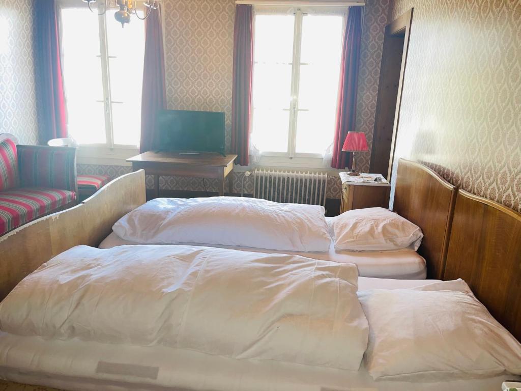 Ένα ή περισσότερα κρεβάτια σε δωμάτιο στο Hotel Sternen Worb