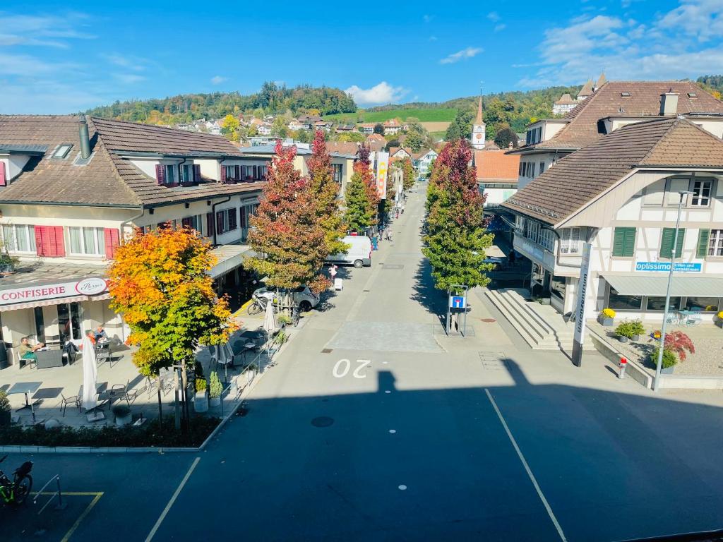 an aerial view of a street in a small town at Hotel Sternen Worb in Worb