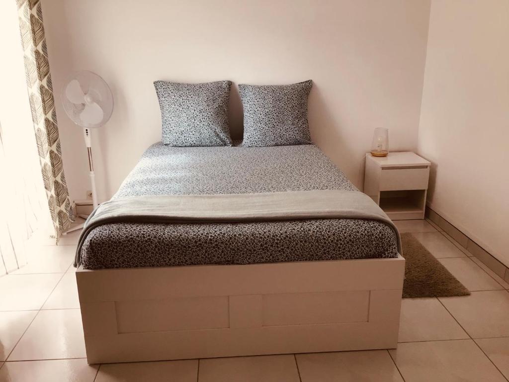 Кровать или кровати в номере LE VERDOYANT : Bel appartement lumineux