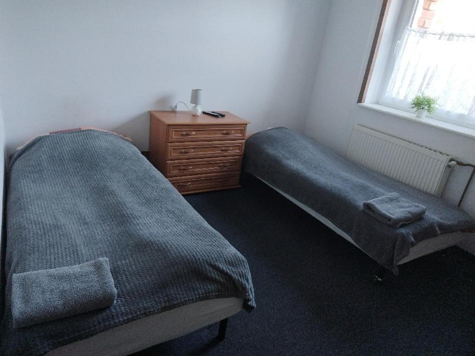 Postel nebo postele na pokoji v ubytování Gościniec Silver