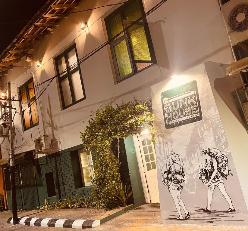 a building with a painting on the side of it at Bunk house Fort Kochi in Cochin