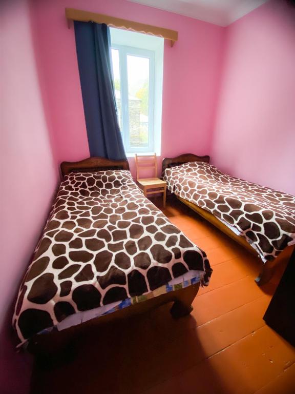 Postel nebo postele na pokoji v ubytování Guesthouse Ailama