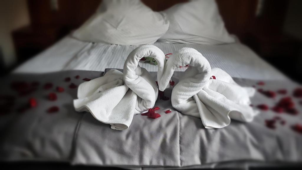 Postel nebo postele na pokoji v ubytování Hotel Malinowski Economy