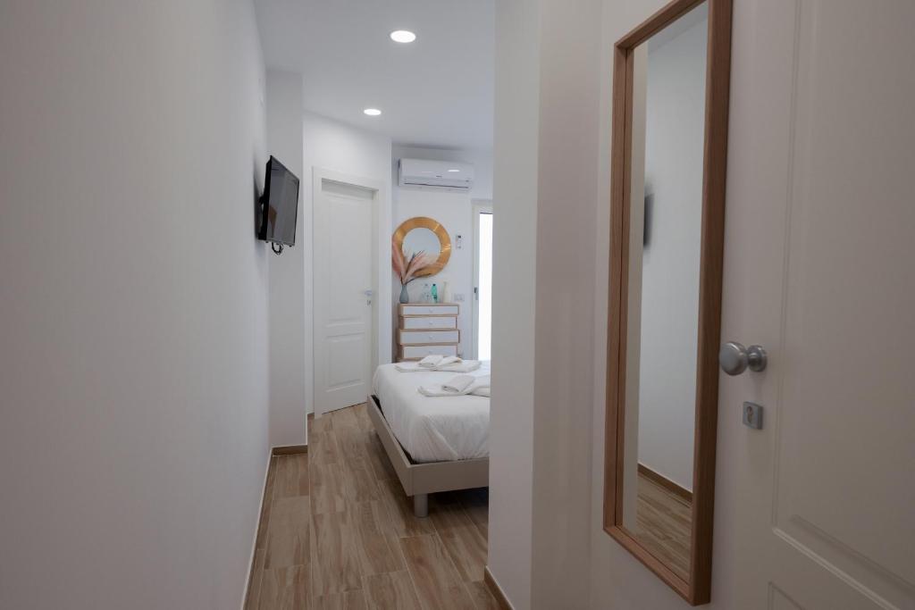 Posteľ alebo postele v izbe v ubytovaní All'Uscita B&b