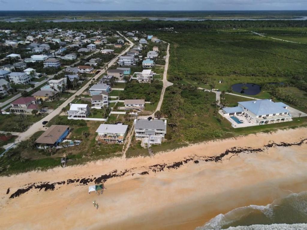an aerial view of a resort on the beach at Tipsy Turtle Direct Oceanfront in Palm Coast