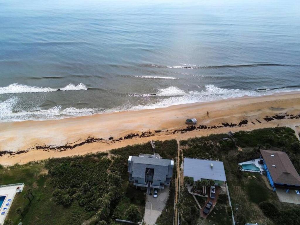 an aerial view of a beach and the ocean at Tipsy Turtle Direct Oceanfront in Palm Coast