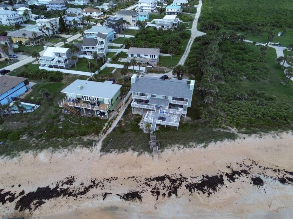 an aerial view of a house on the beach at Tipsy Turtle Direct Oceanfront in Palm Coast