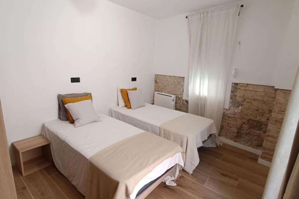 Postel nebo postele na pokoji v ubytování BOUTIQUE Apartment AVE Centro Lleida