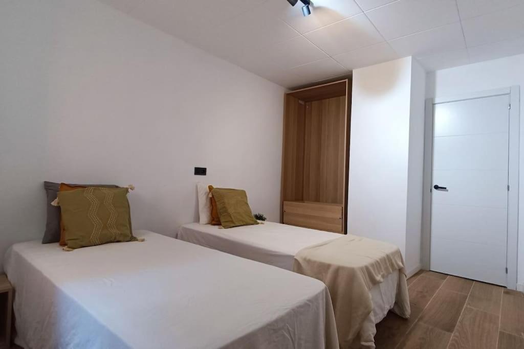 Postel nebo postele na pokoji v ubytování BOUTIQUE Apartment AVE Centro Lleida
