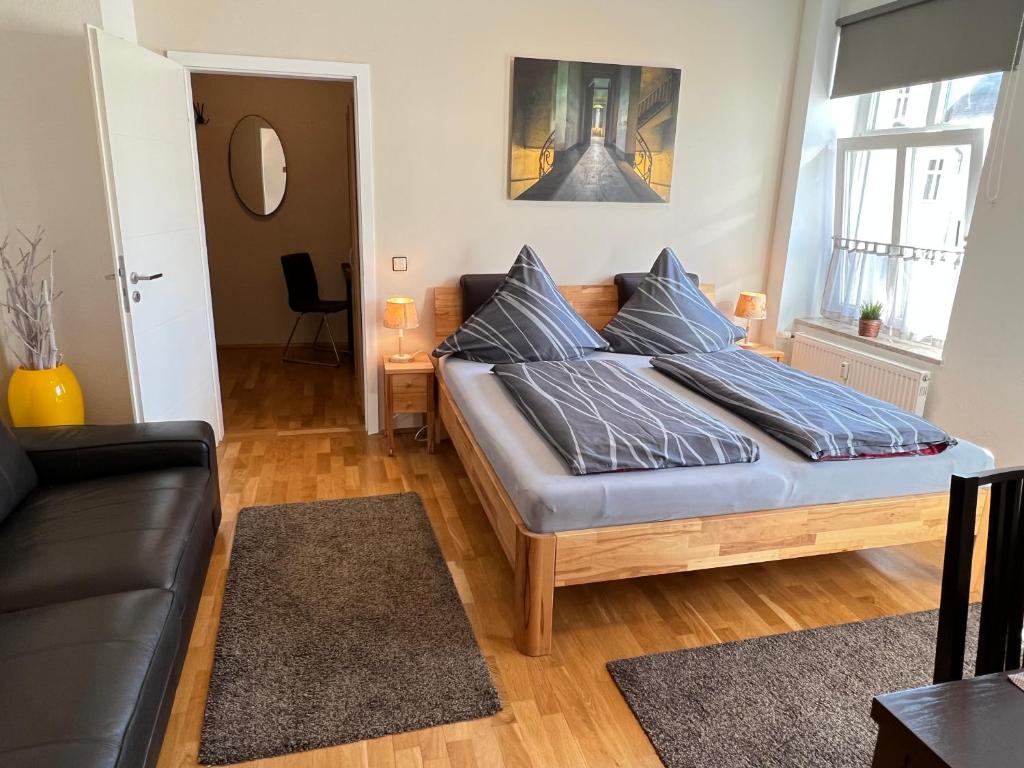 Postel nebo postele na pokoji v ubytování Pension-Leipzig-Süd