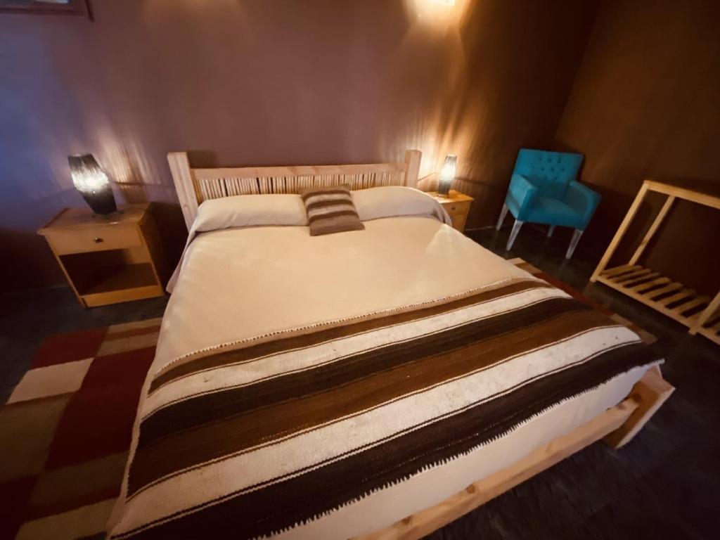 Postel nebo postele na pokoji v ubytování Hostal Katari