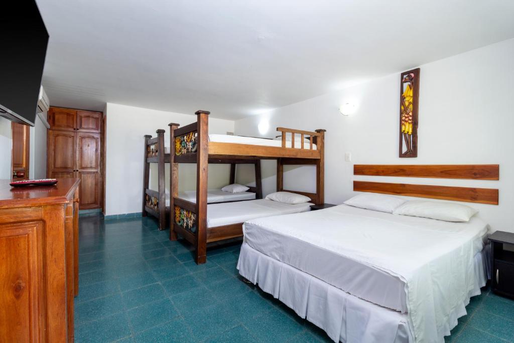 Postel nebo postele na pokoji v ubytování Hotel El Danubio Campestre