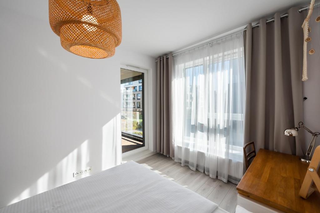 Posteľ alebo postele v izbe v ubytovaní Ingenious Wilanów Oasis Apartment