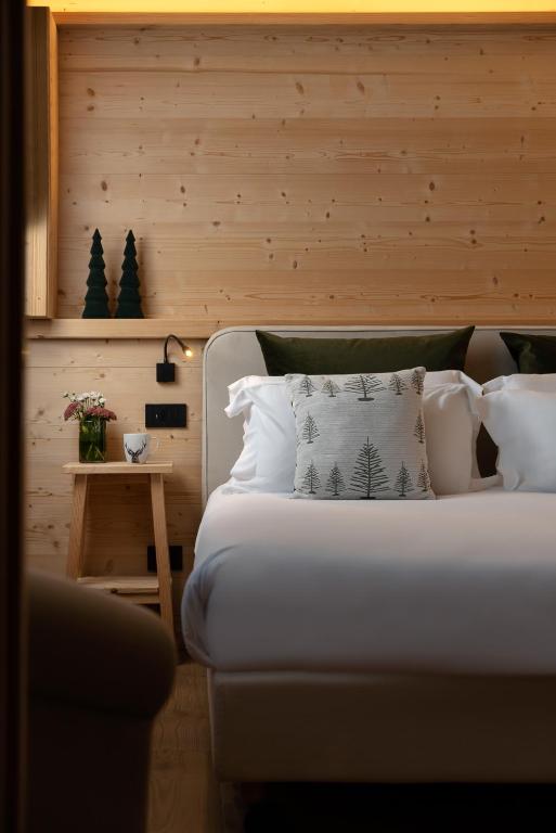 Postel nebo postele na pokoji v ubytování Hotel Baita Dei Pini