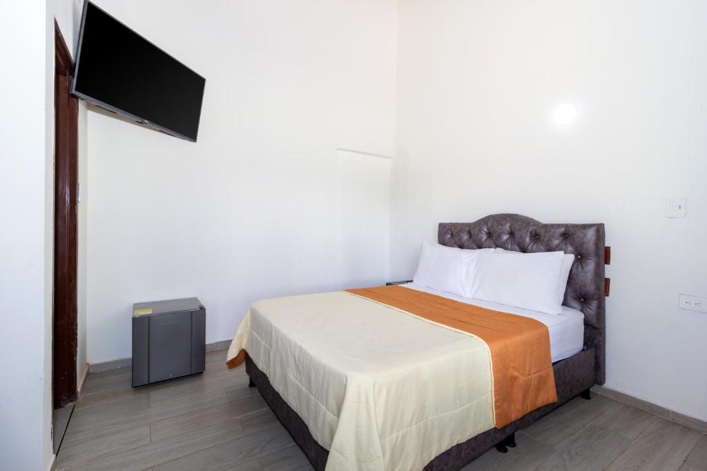 Postel nebo postele na pokoji v ubytování Hotel El Danubio Campestre