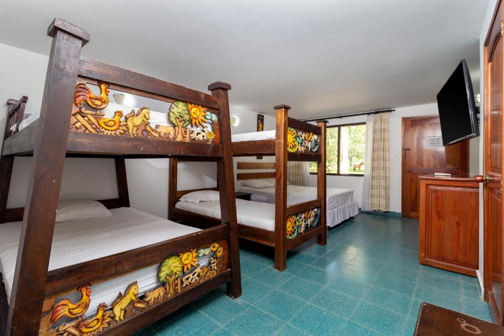Postel nebo postele na pokoji v ubytování Hotel El Danubio Campestre