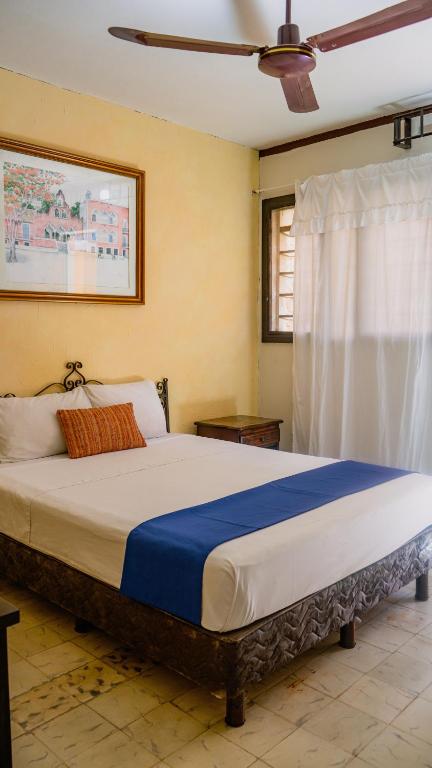 Postel nebo postele na pokoji v ubytování Hotel Mucuy