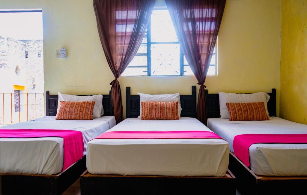 Postel nebo postele na pokoji v ubytování Hotel Mucuy