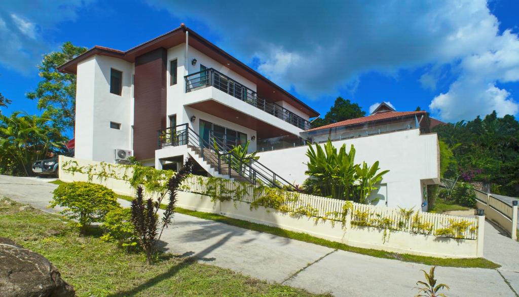 a house on the side of a hill at Samui Sunrise Seaview Villa in Chaweng