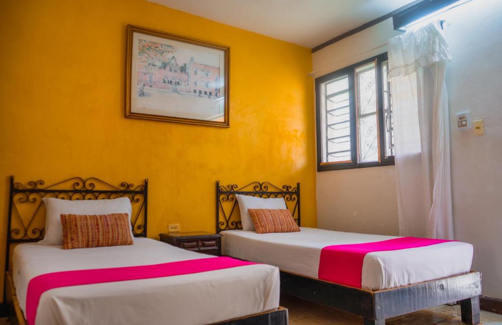 Postel nebo postele na pokoji v ubytování Hotel Mucuy