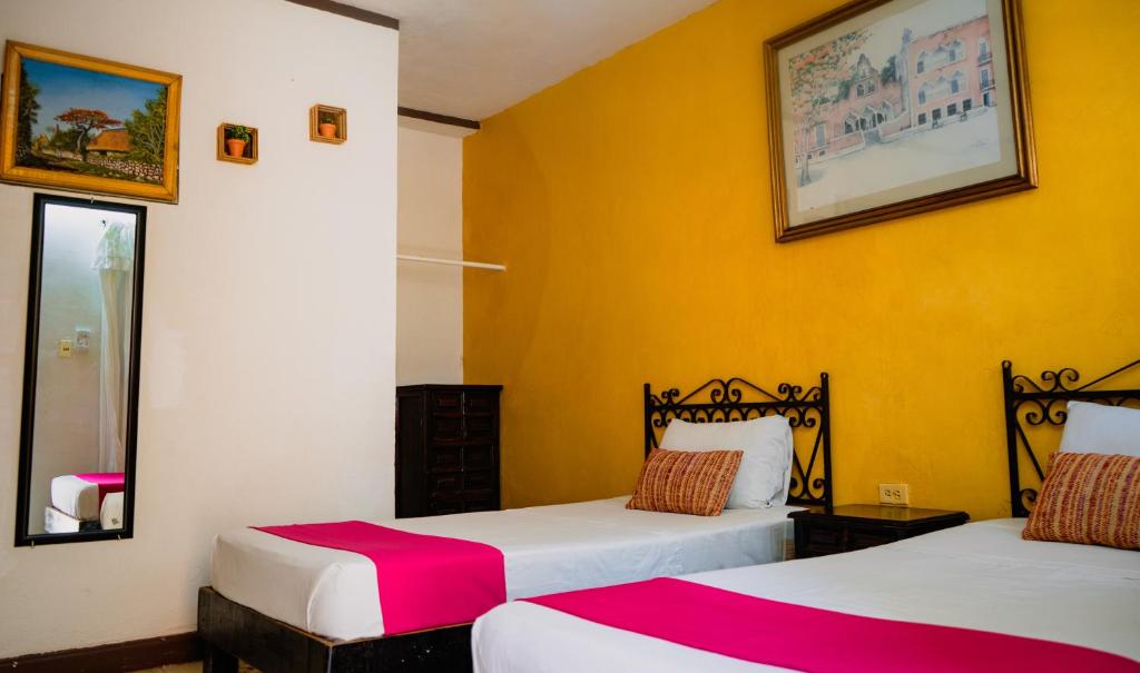 Postel nebo postele na pokoji v ubytování Hotel Mucuy