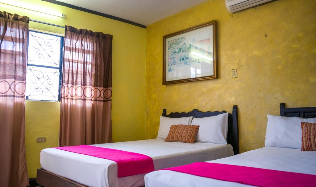Postel nebo postele na pokoji v ubytování Hotel Mucuy
