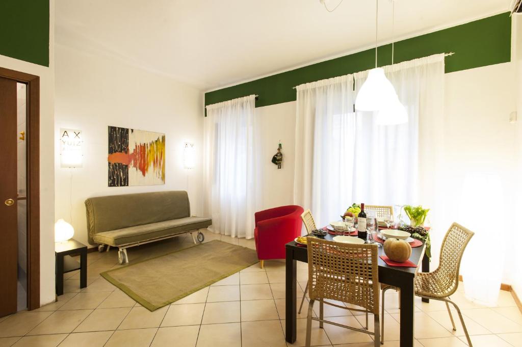 a living room with a table and a couch at Al Vicolo Palermo in Palermo