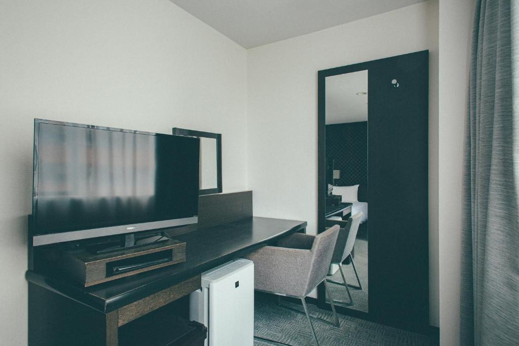 TV a/nebo společenská místnost v ubytování Hamilton Hotel Black