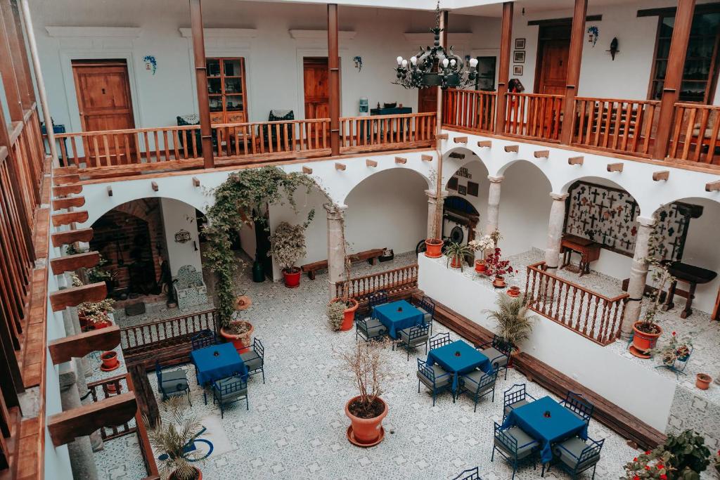an overhead view of a building with tables and chairs at Casa Alquimia in Quito