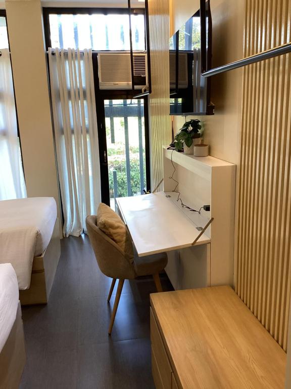 Postel nebo postele na pokoji v ubytování D' Residences