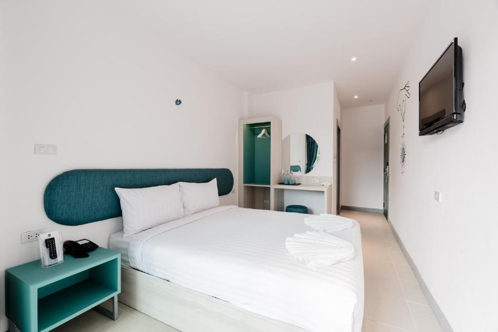 Postel nebo postele na pokoji v ubytování Moon Budget Hotel