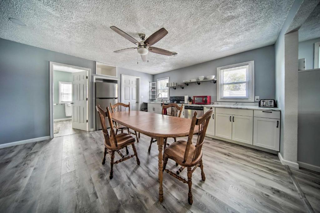 a kitchen and dining room with a table and chairs at Spacious Geneva House Less Than 5 Mi to The Strip! in Geneva