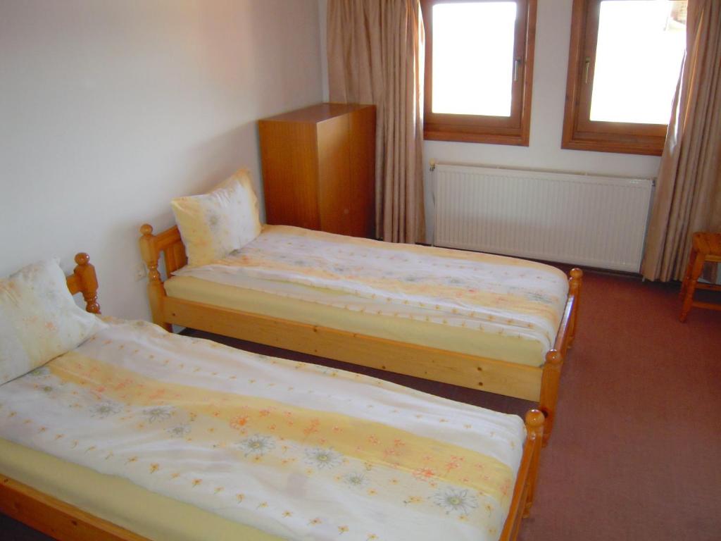 Postel nebo postele na pokoji v ubytování Panorama Hotel