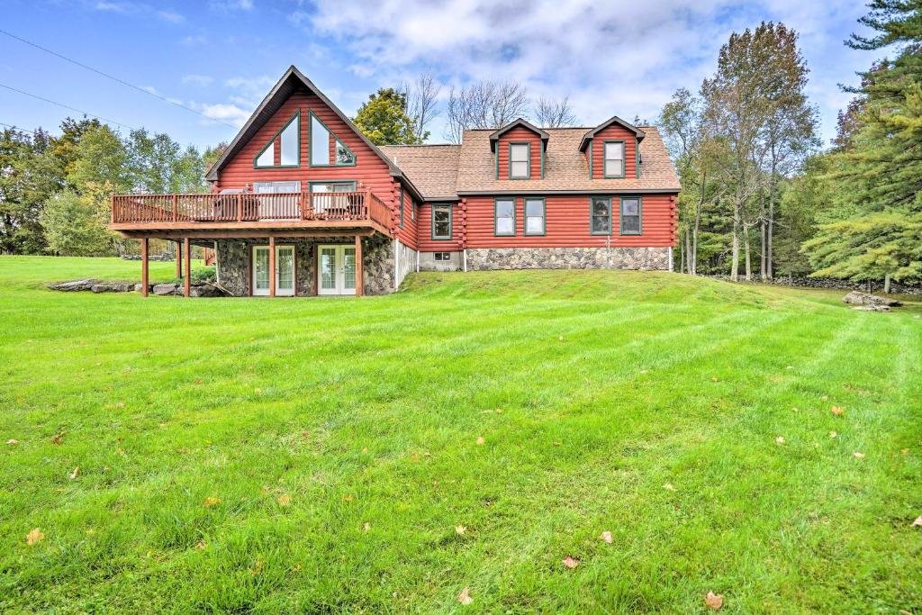 a large red house with a large yard at Grand Windham Retreat with Fire Pit and Game Room in Windham