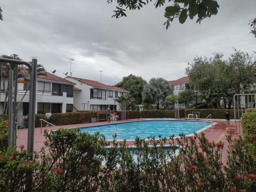 a swimming pool in the middle of a yard at El Refugio de la Estancia in Melgar
